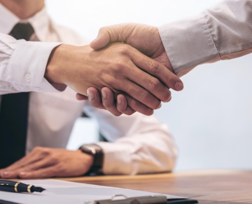 Image of business people shaking hands.